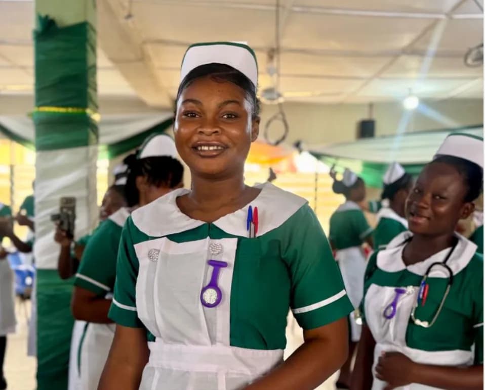 Nursing student in clinical training facility with other students in background